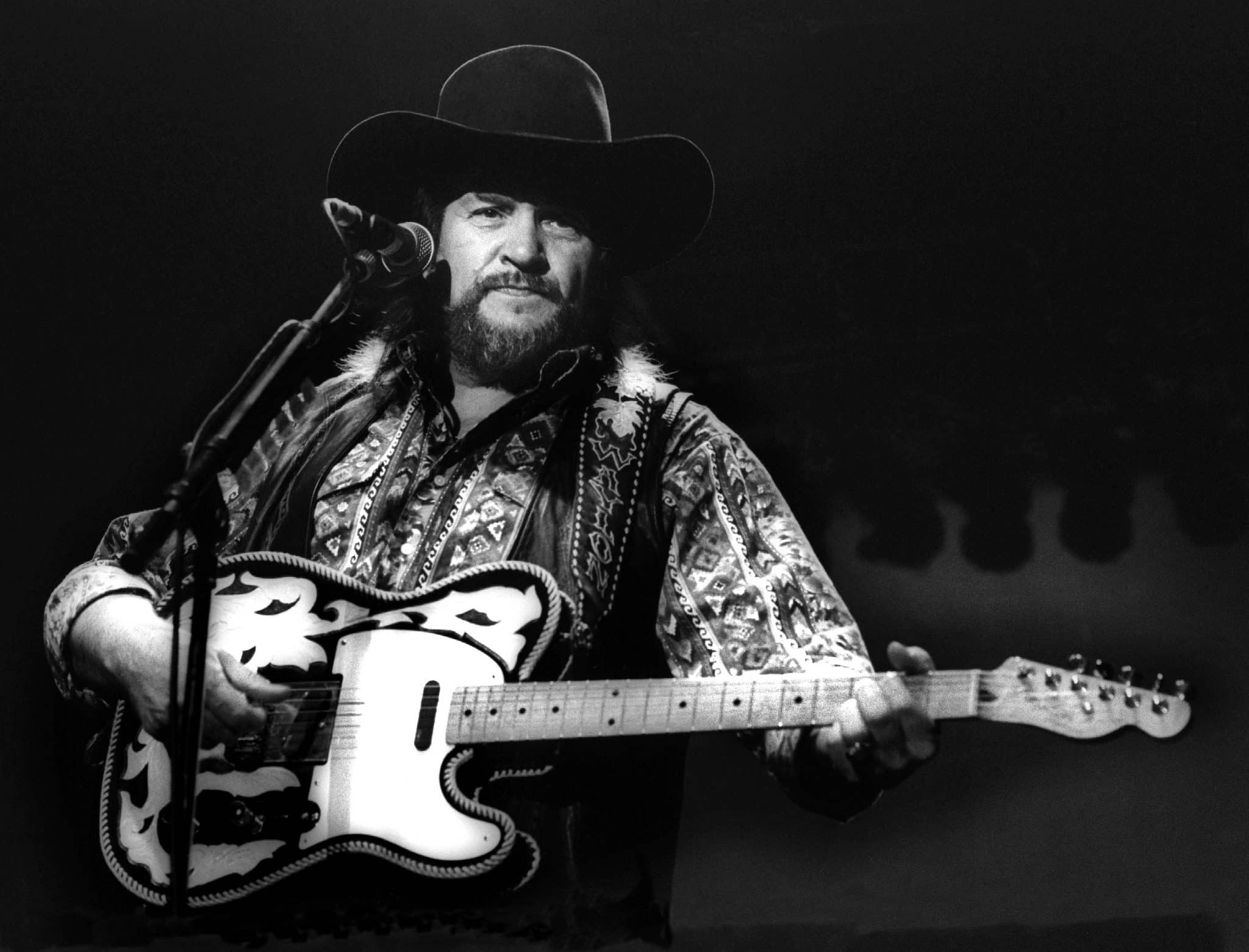 Waylon Jennings of The Highwaymen performs on stage, Ahoy, Rotterdam, 20th April 1992. He plays a Fender Telecaster guitar. 