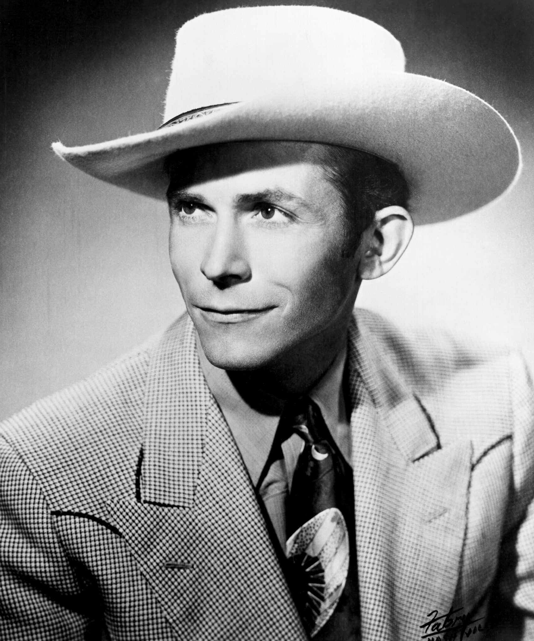 Minnie Pearl told Hank Jr. a funny story about his dad, Hank Williams, pictured here