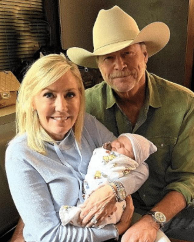 Alan Jackson and his wife Denise with their grandson