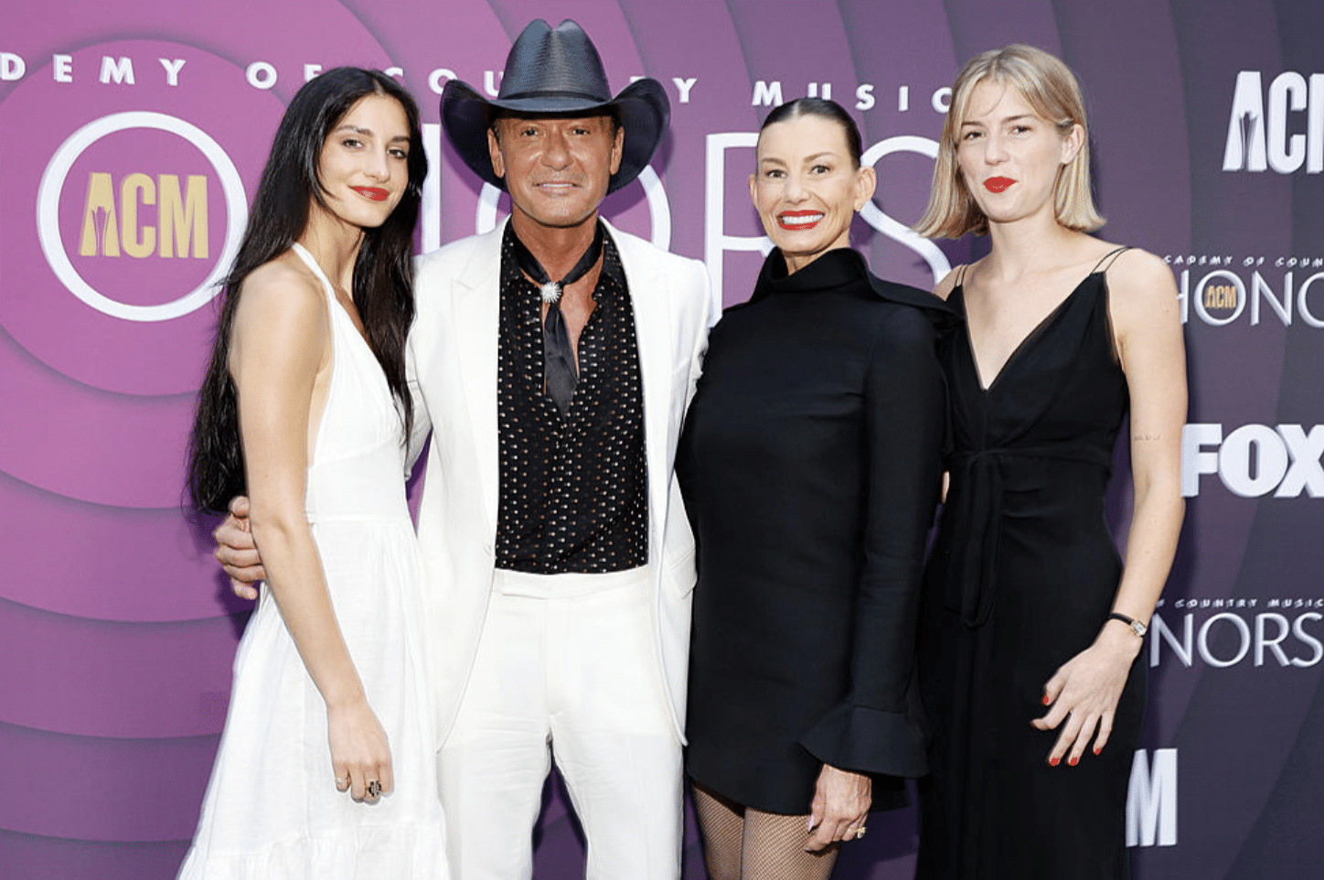 Tim McGraw poses with Faith Hill and daughters, Maggie and Audrey, ahead of ACM Honors.