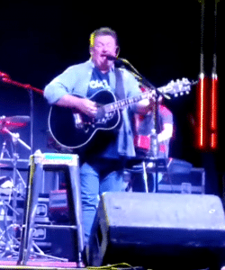 Photo of Joe Diffie singing "Third Rock From the Sun" in one of his last performances. 