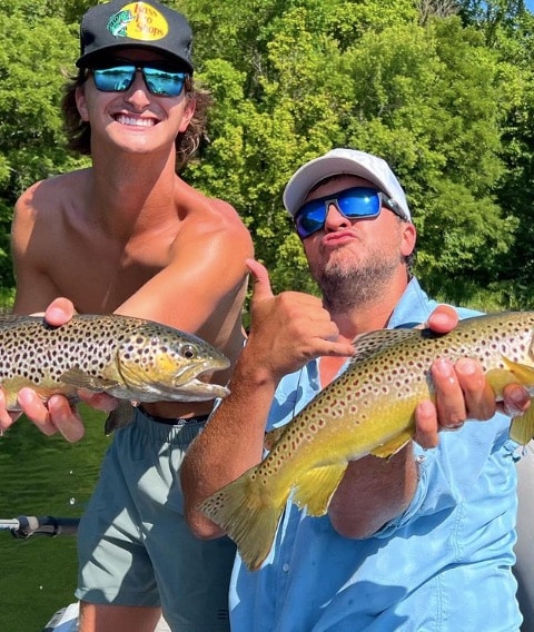 Luke Bryan poses for a celebratory photo after fishing with his nephew, Til