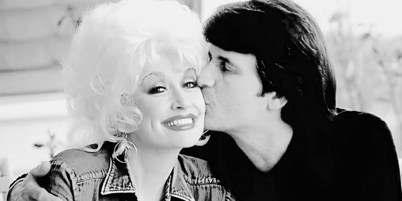 Dolly Parton gets kiss on the cheek from her husband Carl Dean, who she married in 1966