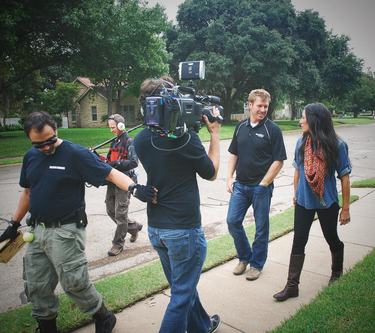 Fixer Upper stars Chip and Joanna Gaines are returning with a new season of the show. Here, they're pictured filming.