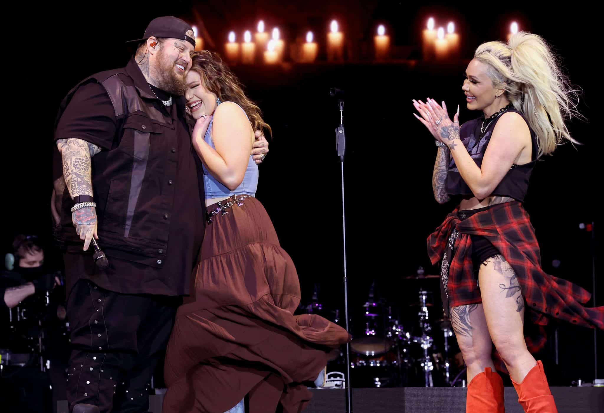 Jelly Roll and his wife Bunnie Xo onstage with daughter Bailee at Stagecoach