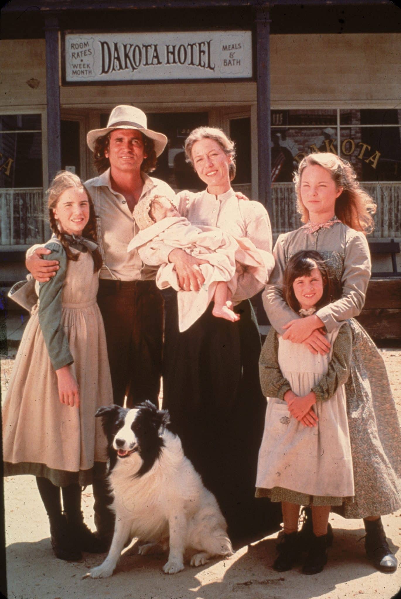 The cast of the television series 'Little House on the Prairie' with a dog on the set of the show, mid 1970s. Clockwise from left: American actors Melissa Gilbert, Michael Landon (1936 - 1991), Karen Grassle, who holds an unidentified baby, Melissa Sue Anderson, and Lindsay or Sidney Greenbush. (Photo by Fotos International/Getty Images)