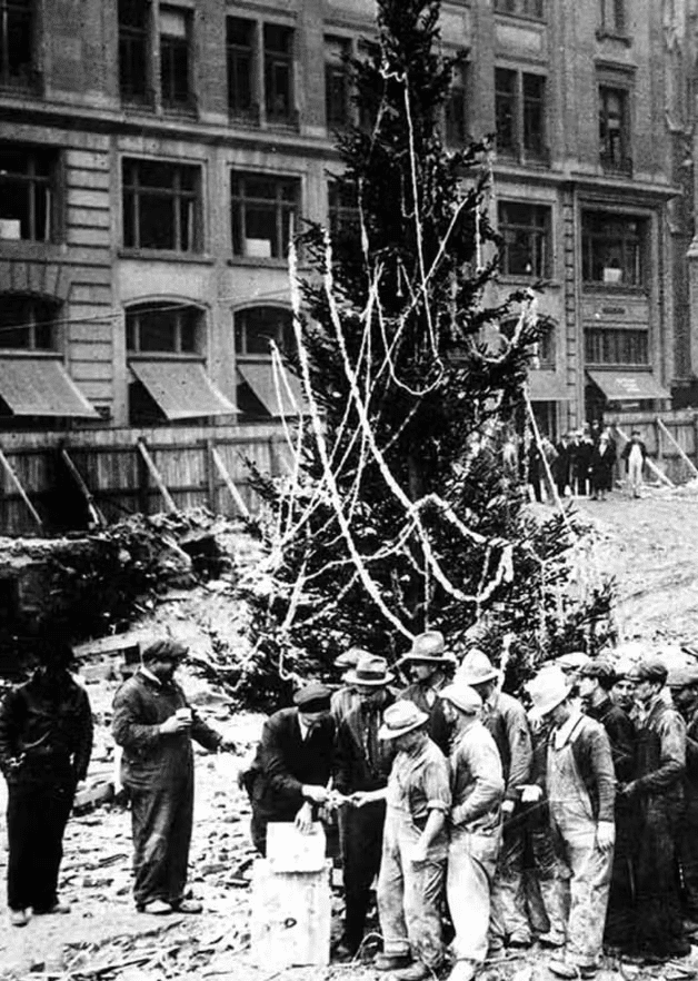 This photo, taken on Christmas Eve 1931, shows Rockefeller Center workers lined up to receive their wages.