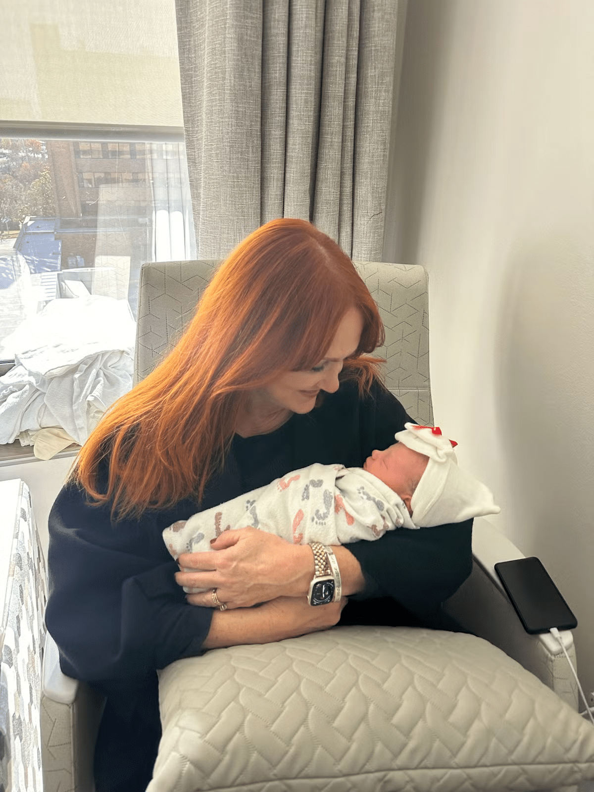 The Pioneer Woman Ree Drummond holds her newborn grandchild, Sofia