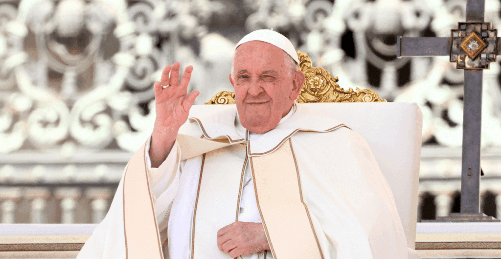 Pope Francis waves in 2024, the year before his death