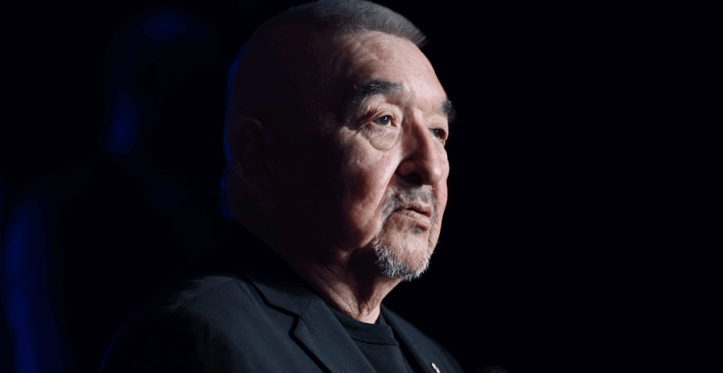 actor Graham Green in a profile shot with shadows cover his cheek