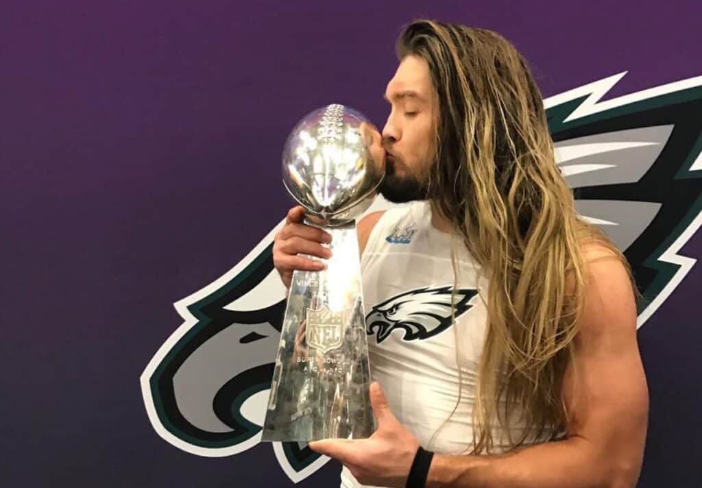 Bryan Braman kisses the Vince Lombardi Trophy after winning the Super Bowl with the Eagles