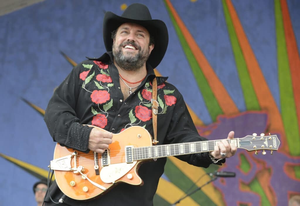 Raul Malo of the Mavericks performing with his guitar onstage