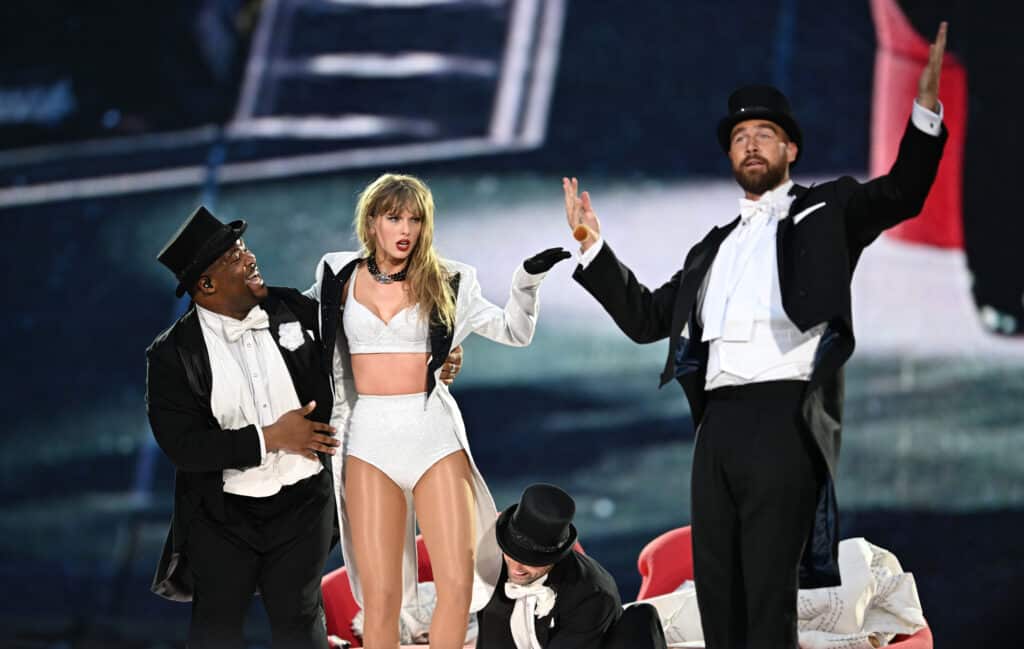 Taylor Swift and Travis Kelce onstage together during the Eras Tour