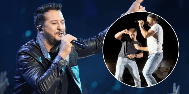 Luke Bryan and a young fan dance on stage together