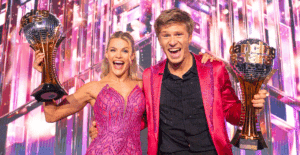 Witney Carson and Robert Irwin hold up their Mirrorball Trophies after winning Dancing with the Stars