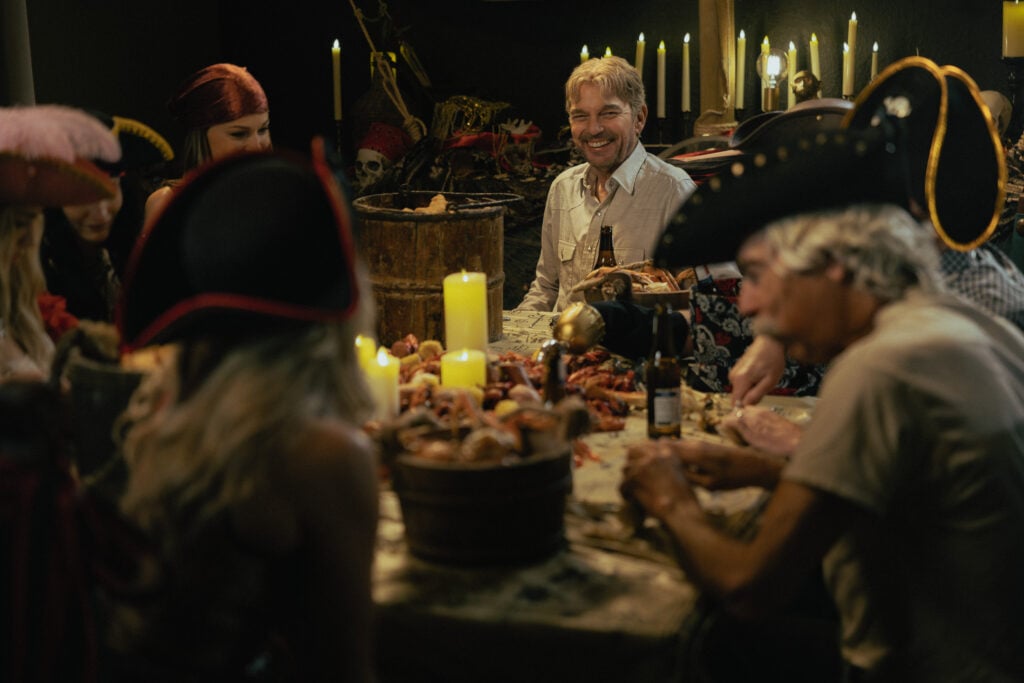 Billy Bob Thornton as Tommy in Landman at one of his wife's themed dinners.